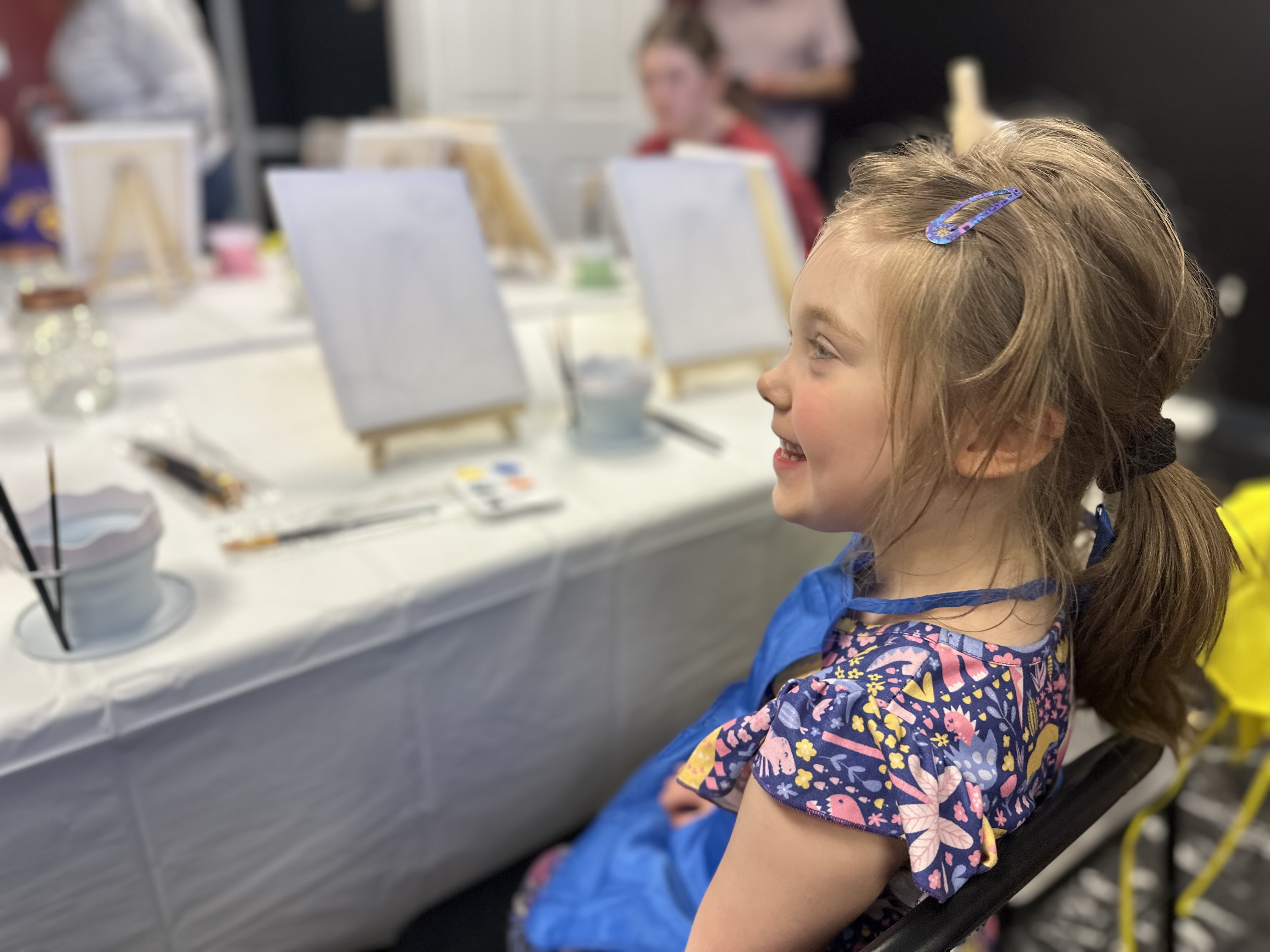 Child painting with watercolors